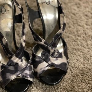 Black and white strappy heel worn about 10 to 15 times